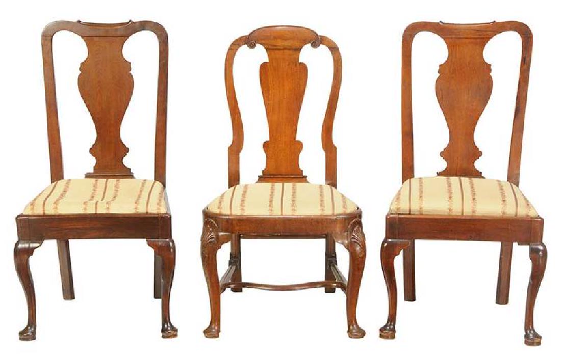 Three George II Carved Mahogany Side Chairs: British, 18th century, cabriole legs, pad feet, comprising: pair, trapezoidal slip seats; together with a balloon seat example, shell carved knees, 40 in. , Provenance: Private Collection, Nashvi
