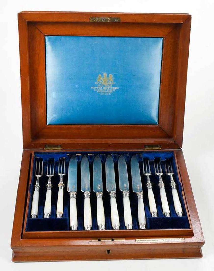 24 Piece English Silver Fruit Set: Sheffield, 1894, mother of pearl handles, English silver blades and tines, marks for Mappin Brothers, Twelve 6-1/2 in. forks; twelve 8 in. knives, with fitted shaped wooden case with brass inset 