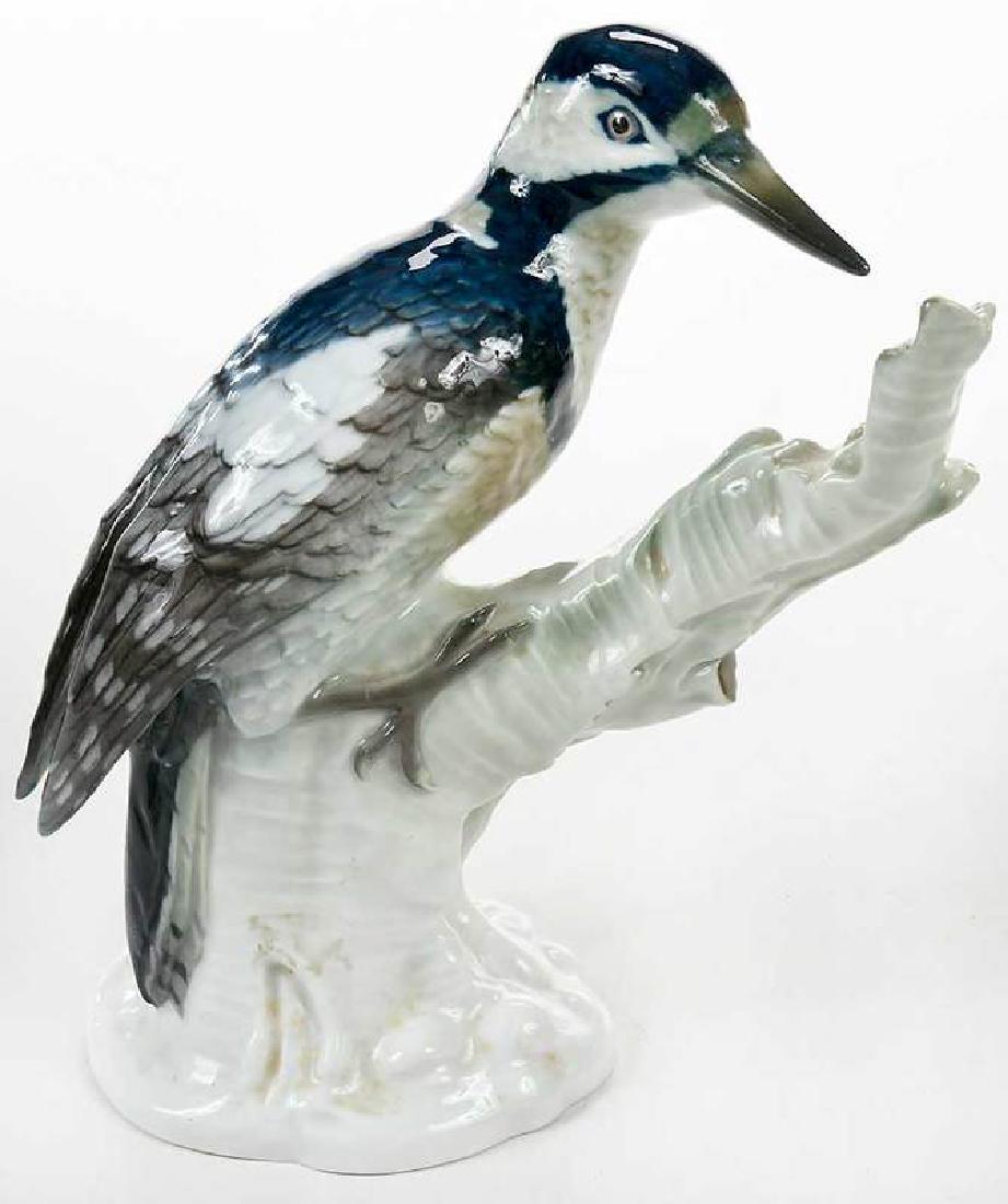 Berlin KPM Porcelain Woodpecker Model: German, late 18th/early 19th century, blue sceptre, blue orb, and KPM marks, naturalistically modelled, perching on tree-stump with enriched blue, white, olive, black plumage, 9-1/2 in. , Provena