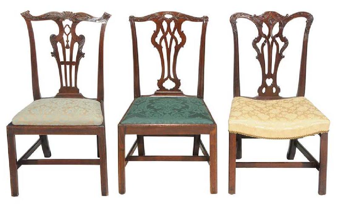 Three Chippendale Dining Chairs: British/Irish, 18th century, each carved mahogany, silk damask upholstery: two Gothic splat; one shell and tassel back; 38 in. , Provenance: