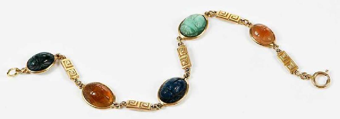 14kt. Gold Scarab Bracelet: five stone carved scarabs including: bloodstone, citrine, sodalite, green serpentine, amber, tested 14kt. yellow gold, 7-1/2 in. lg., 9.3 grams , Provenance: Private Collection, Asheville, North