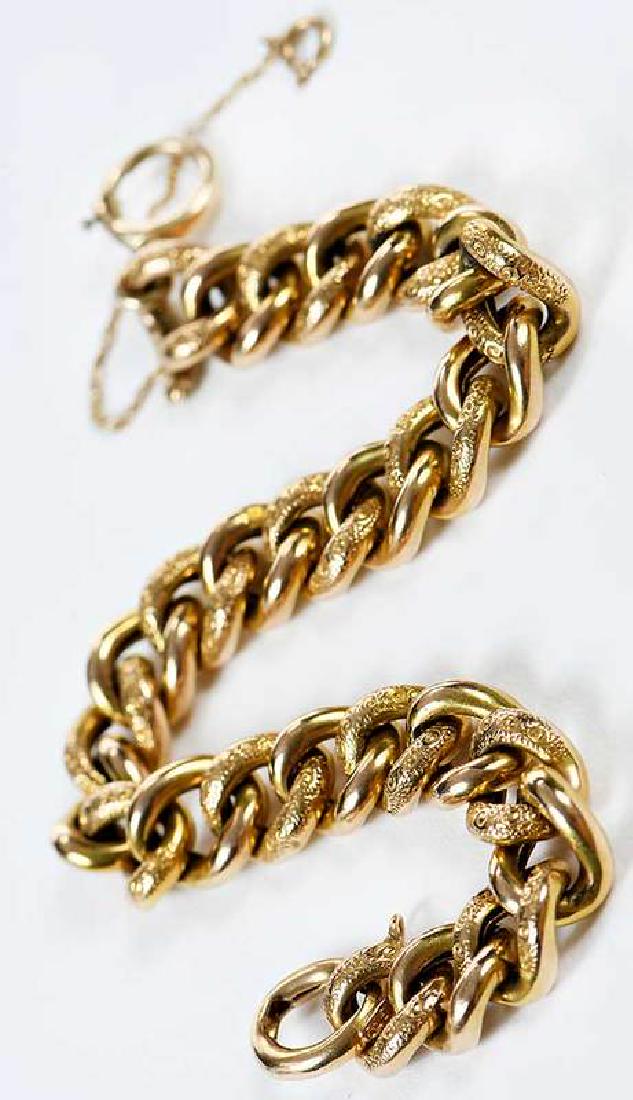 Gold Bracelet: hollow curb link chain, engraved links, stamped "15ct", tested 14kt. yellow gold, 3/8 in. wide, 7-3/4 in. lg., 14.2 grams , Provenance: Private Collection, Asheville, North Carolina