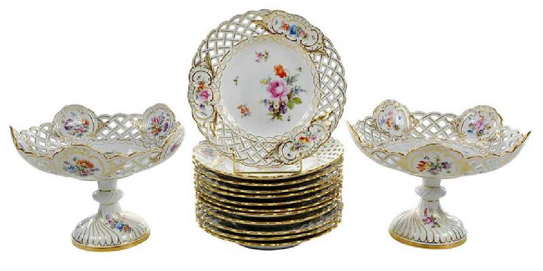 14 Piece Meissen Partial Dessert Service: German, 20th century, each with crossed swords in underglaze blue, most with factory marks verso, reticulated, hand painted floral and insect motif with gilt detail, comprising: pair compotes with swi