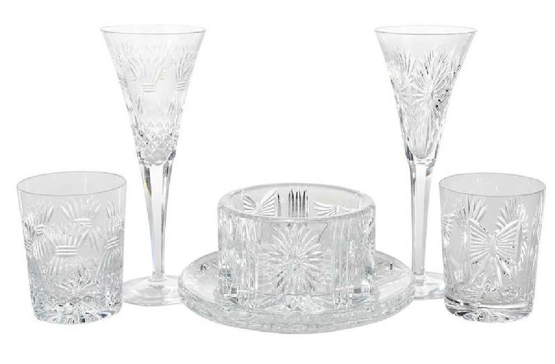 Waterford Millennium Cut Glass Partial Service: Irish, 21st century, 19 objects, each with etched mark for Waterford, comprising: 12 fluted champagnes, 9-1/4 in.; four double old fashioneds, 4-1/4 in.; two luncheon plates, 8 in.; bottle coaster, 5-