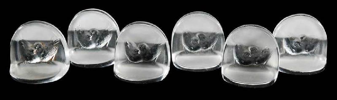 Six R. Lalique Pinsons Glass Place Card Holders: model introduced 1924, model number 3501, engraved "R.Lalique", 1-3/4 x 1-7/8 in , Provenance: Estate of Dr. Philip George, Memphis, Tennessee