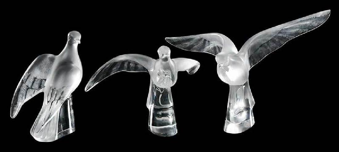 Three Lalique Frosted Glass Bird Figures: all engraved "Lalique France", 9-1/2 in to 12 in. , Provenance: Estate of Dr. Philip George, Memphis, Tennessee