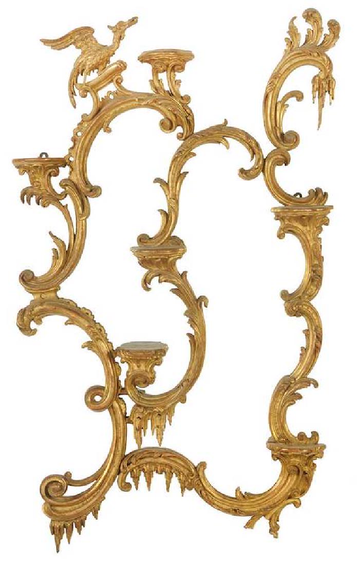 Fine Chippendale Style Carved and Gilt Mirror: British, probably 19th century, phoenix finial, elaborate leaf, scroll ornaments, six small shelves, 46 x 32 in. , Provenance: Estate of Dr. Philip George, Memphis, Tennessee