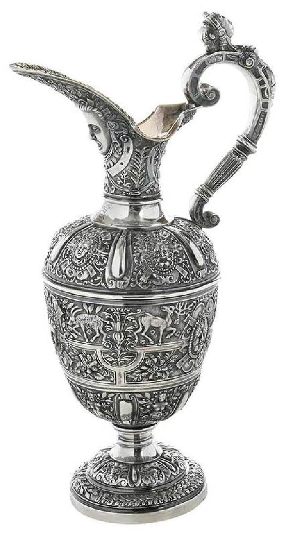 Hunt & Roskell Silver Pitcher: London, 1867, urn form, mask spout, caryatid handle, beaded and female mask roundels among scrolls and foliate, gilt interior, heraldic device, "C" with crown, marks for John Samuel Hunt, ba