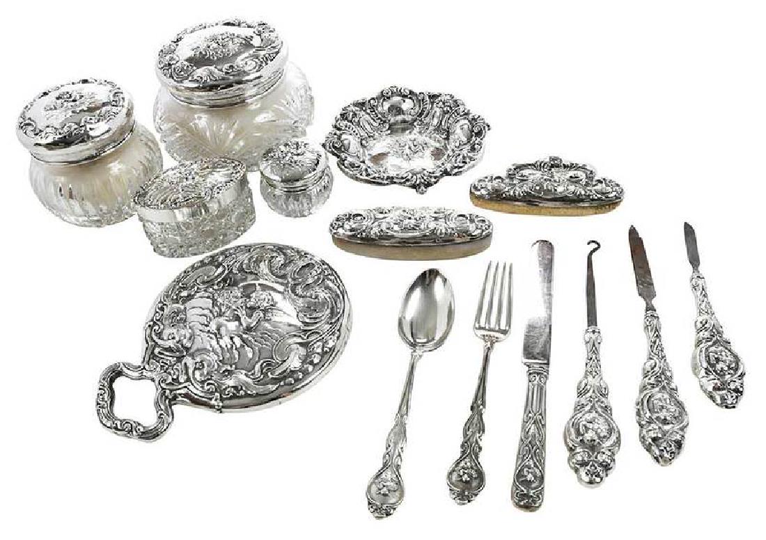 Unger Sterling Love's Dream Set, 22 Pieces: early 20th century, including four jars with glass bases; two mirrors; five brushes, [two with new bristles]; two nail buffs; pin tray; button hook; glove stretcher; two nail files; three piece youth 
