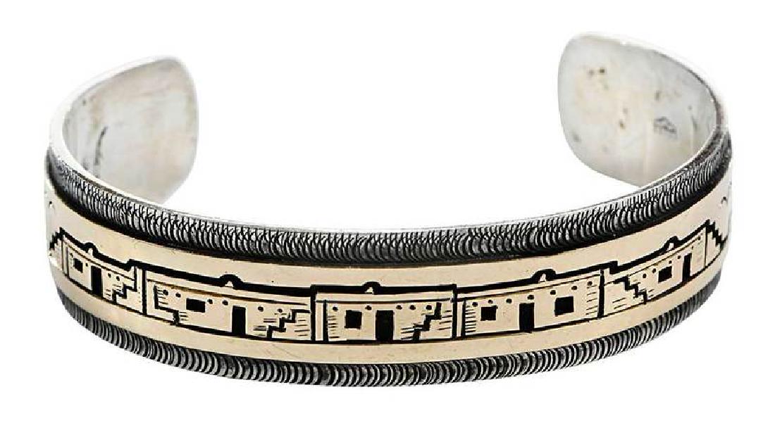 Victor Coochwytewa 14kt. Gold & Silver Bracelet: cuff, adobe design, stamped "Sterling-14K" and with maker's marks, yellow gold, 5/8 in. wide, 5-3/8 in., 39.7 grams , Provenance: Estate of Alice Carter Middendorf