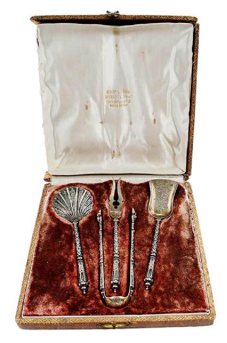 Cased Gilt French Silver Flatware: 19th century, Renaissance Revival decoration, including bon bon, shovel, tongs and olive fork, 3 grams, 5-1/2 in to 5-1/3 in.; with fitted case, Provenance: Private Collection, North Carolina