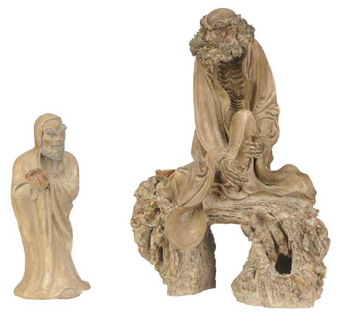 Two Shiwan Pottery Buddhist Monk Figures: Chinese, 20th century, large seated figure on a tree stump, mostly unglazed earthenware, seal mark and inscription verso, [repaired thumb, losses to hair and beard], 22 in.; standing robed figure hold