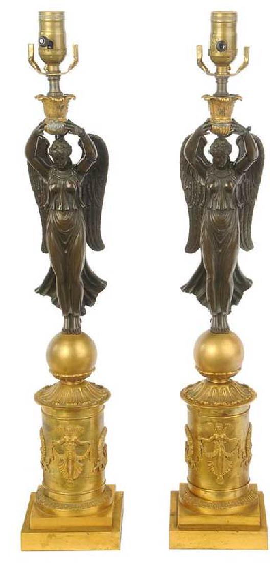 Pair Empire Style Parcel Gilt Bronze Lamps: French, 19th century, each bronze caryatid presenting an ormolu capital set with single electric socket, 27 in. to socket, Provenance: Collection of Stephanie Edgar and William B. Reeves, Atlanta