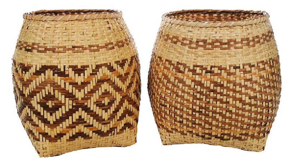 Two Emma Garrett Cherokee Storage Baskets: Qualla Boundary, North Carolina, attributed to Emma Garrett, river cane with colors for walnut and bloodroot, old style rims, both signed "Emma Garrett" on bottom, lot accompanied by two photographs o