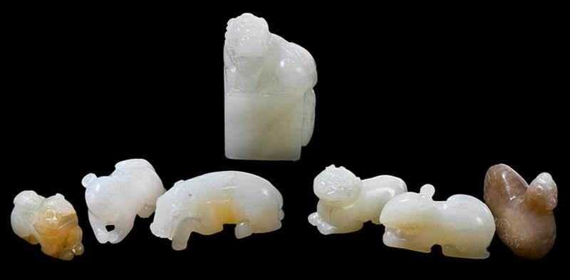Seven Small Carved Jade Toggles of Animals: Chinese, fu dog on stand, 2 in.; anteater, 1-3/4 in.; squirrel, 1-1/2 in.; mouse, 1-1/4 in.; hen, 1-1/2 in.; two small fu dogs, 1-3/8 in.ÿ
