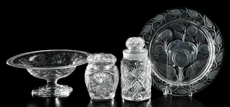 Four Brilliant Period Cut Glass Table Items: biscuit jar, sunburst style; humidor, strawberry and fan pattern variation; tray, intaglio apple design, possibly Pairpoint or Pitkin & Brooks; pedestal bowl, "rock crystal", Hawkes marks; largest 5 x