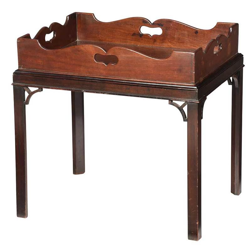 Two George III Mahogany Trays with Stands: British, late 18th/early 19th century, dovetailed butler's tray with pierced handles set on modern frame, 24-1/2 x 25-1/2 x 19-1/2 in.; together with dovetailed cutlery tray on modern stand; Provenanc