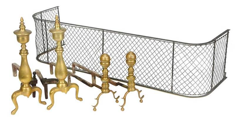 Five Brass Fireplace Accessories: 19th/20th century, comprising: early pair smallÿclassical andirons, each 12 x 22-1/2 x 6 in.; pair urn form andirons, each 19 x 16 x 8 in.; D form grillwork fender, 12 x 49 x 15 in.; Provenance: Priv