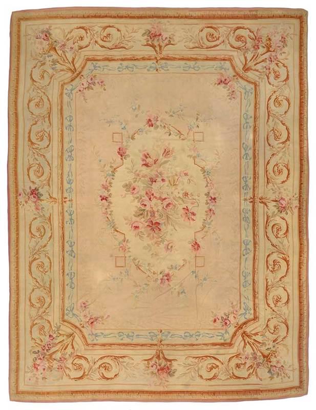 Aubusson Style Tapestry Rug: Continental, 19th/20th century, central floral medallion with blue ribbon border, 14 ft. 3 in. x 10 ft. 3 in.; Provenance: Private Collection, North Carolina