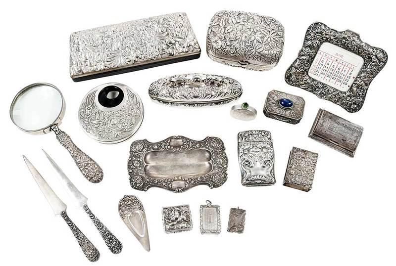 18 Sterling Repousse Desk and Dresser Pieces: most American, Kirk atomizer, desk calendar, two letter openers, soap box, book mark, match cover; Unger Brothers nail buff and fitted tray; Gorham glass case; two English silver vinaigrettes; pin tra