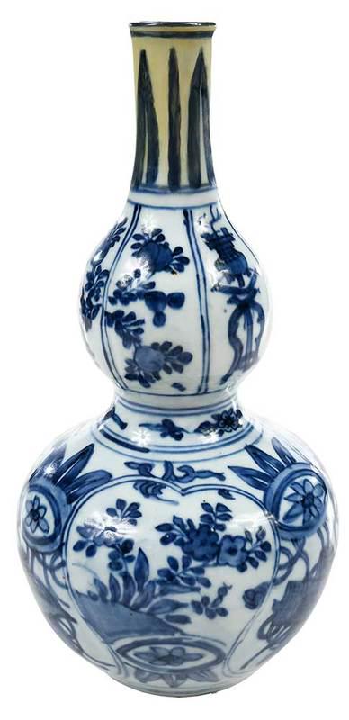 Early Blue and White Chinese Double Gourd Vase: possibly Ming dynasty, depicting panels of pomegranates, floral sprays, and antiquities, 12 in.; accompanied with bill of sale from Me C-A Persson Collection, November 17, 1986, "Vase Wan-Li Period ca