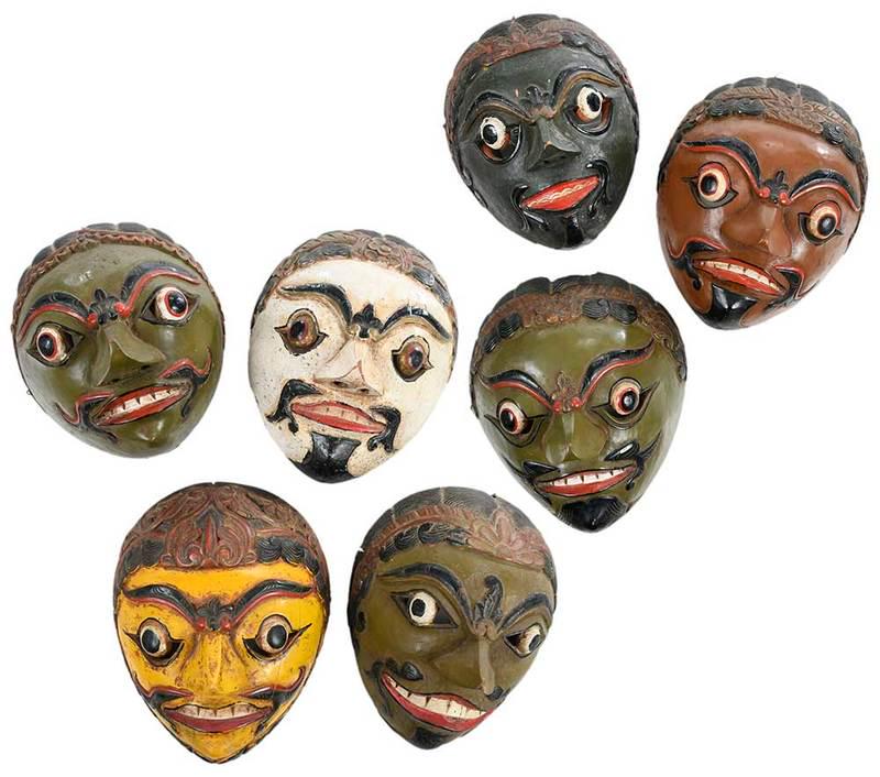 Group of Seven Polychrome Indonesian Masks: 19th/20th century, carved and painted wood in a variety of colors, mustached and bearded men with headdresses, each approximately 6-3/4 in., Provenance: Indonesian Islands Art, 1980s; Edwards Living E