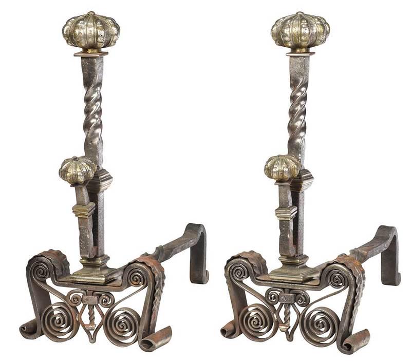 Large Pair Iron and Silvered Brass Andirons: early 20th century, in the Renaissance style, twisted wrought iron shaft with reeded top, elaborate scrolled feet, 26 x 12 x 28 in., Provenance: Golden Associates, Charleston (sticker attached); Priva