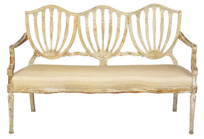 Sheraton Style Painted Settee: early 20th century, faux distressed white and gold paint with three shield backs, modern silk upholstery, 36 x 56 x 24 in., Provenance: Private Collection, South Carolina