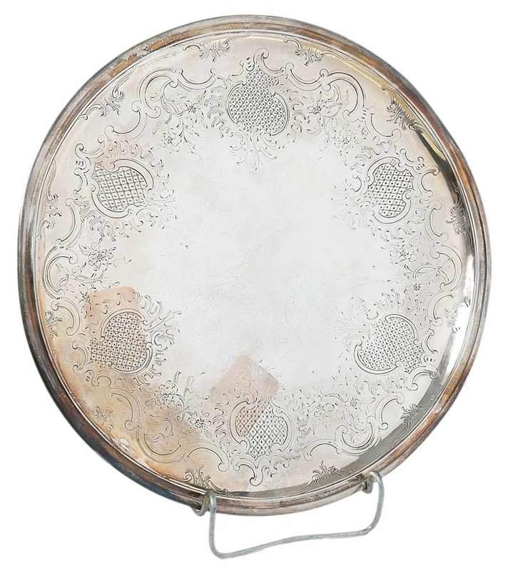 English Silver Footed Tray: possibly 1702, round with engraved floor, no monogram, partial?marks on front, spurious Paul de Lamerie mark, 15.24 oz. T.,? test .900 or better, 1-1/4 in. x 10-1/4 in., Provenance: Collection of Jame