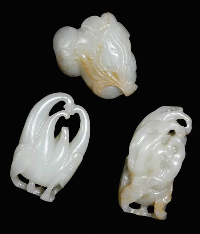 Two Jade Buddha's Hand of Citron, and Jade Lotus: Chinese, buddha's hand of citrons with carved stem and leaves, largest 2-1/2 in.; double lotus pod, 2 in., Provenance: Private Collection, Georgia