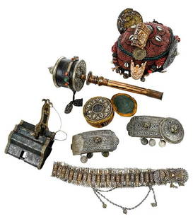 Six Eurasian Ceremonial Items: late 19th/20th century, including Tibetan coral beaded hat with carved mask, metal medallions and shells, 9-1/2 in.; Nepal prayer wheel with mounted stones, 17 in.; Tibetan travel Buddha shrine with