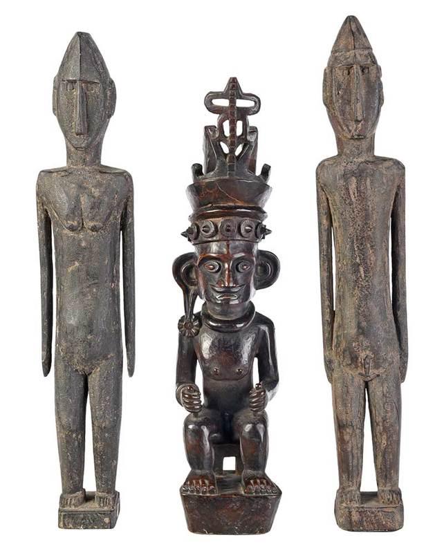 Three Indonesian Ancestral Guardian Wood Figures: early 20th century, Nias Island finely carved seated figure wearing elaborate headdress, possibly Adu Zatua, fine old dark patina, 18-1/2 in.; two similarly carved standing male and female figures, ta
