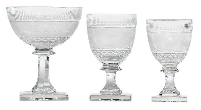 35 Piece Set of Anglo Irish Cut Crystal Stemware: British, late 19th/20th century, 12 low sherbert glasses, 12 wine glasses, 11 cordial glasses, all wheel cut etched crystal, depicting stags and scrollwork within a landscape, on squared waffle bases,
