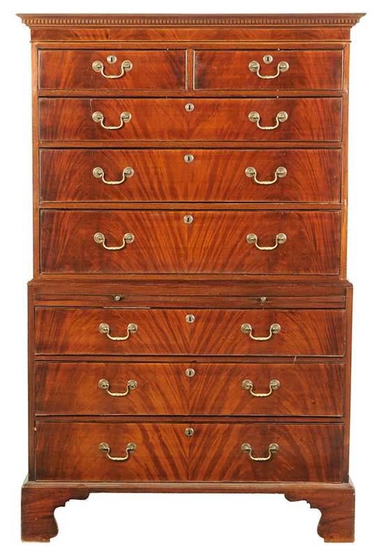 George III Figured Mahogany Chest On Chest: British, late 18th century, figured book matched veneers, dovetailed drawers, brush slide, bracket feet, 73-1/2 x 43-1/2 x 21 in., Provenance: Collection of Hollister Houghton, Aiken, South Carolina