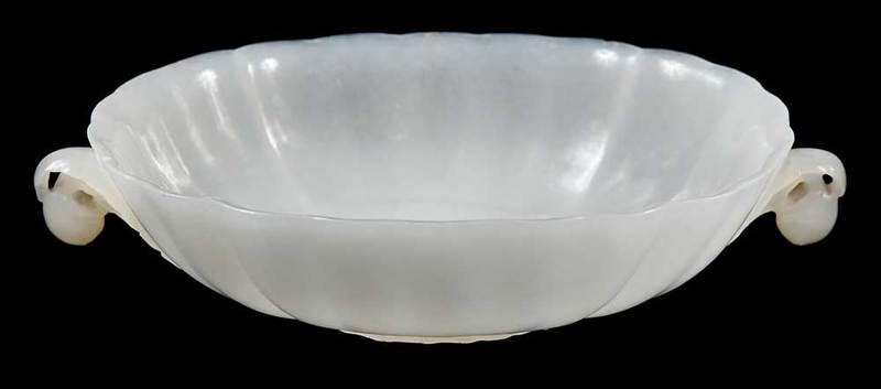 White Jade Mughal Style Carved Dish: Chinese, Qing dynasty, delicately carved, ovoid lotus blossom form, two foliate handles with dangling peaches, flower form base, 4-1/2 in., Provenance: Collection from an Important American Family