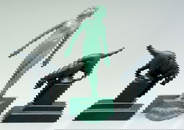 Three Frankart bookends: pair with panthers on pedestals, marked "Frankart" on back of bases, 6-1/4 x 4-1/2 x 3-3/4 in., [probably repainted]; single bookend of cast metal nude woman standing on bow of boat, unmarked, probabl