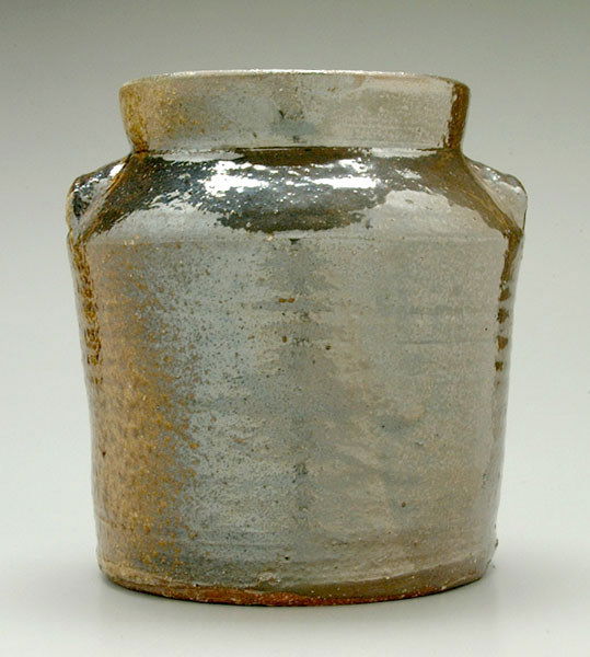Penland stoneware jar,: tapered with everted rim, brown to light mottled olive Albany slip glaze, base impressed "Penlands Pottery, Candler NC" below incised "2", base marked in chalk "Penlands Pottery, Candler NC $28", 10 x