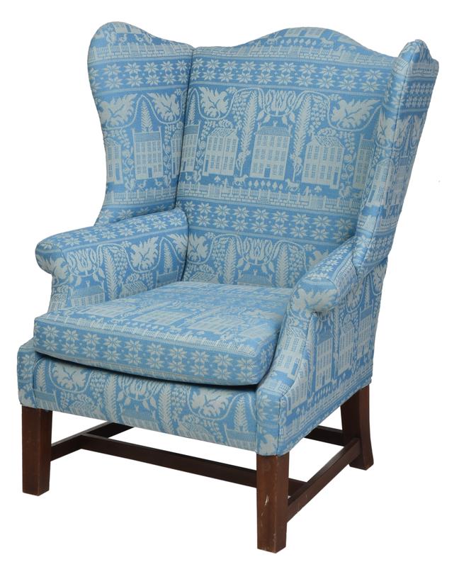Chippendale Style Upholstered Wing Back Armchair: 19th/20th century, with modern blue upholstery depicting flowers, animals, and town houses, stretcher base, 45-1/2 x 36-1/2 x 25 in., Provenance: Collection of Anthony Baratta, New York, New York
