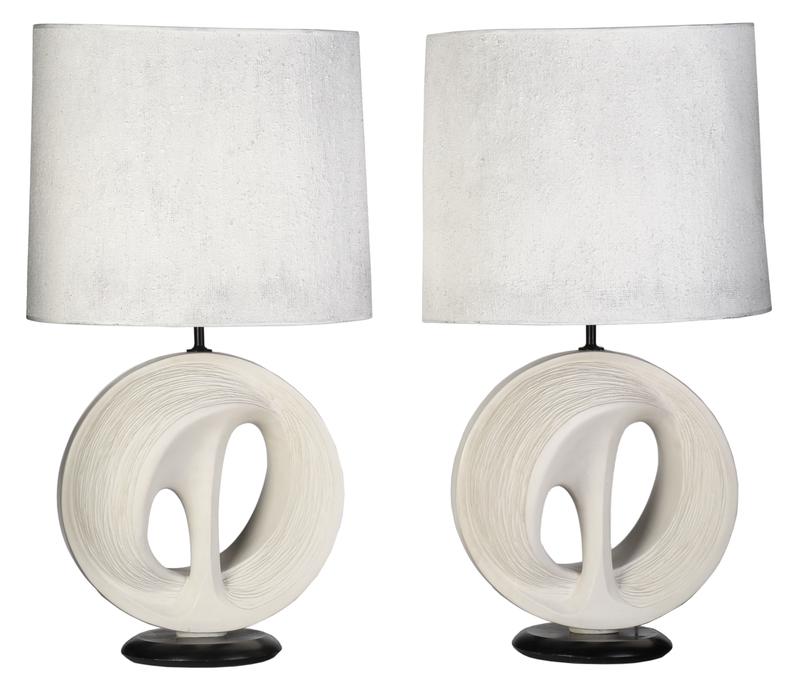 Pair of Modern Sculptural Plaster Table Lamps: attributed to Dame Barbara Hepworth, (British, 1903-1975), abstract organic circular forms, white paint on plaster, mounted on black painted wood bases, with white painted shades, apparently unsigned,