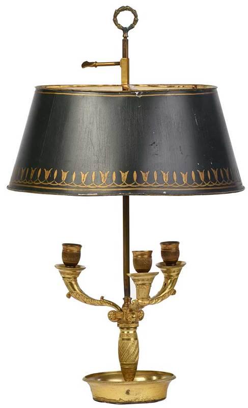 French Empire Ormolu Tole Lamp: early 19th century, converted three arm candelabra, round drip pan base, scrolling leaf and floral motifs, two sockets at top, dark green tole shade with hand painted gilt borders, wreath finial, with