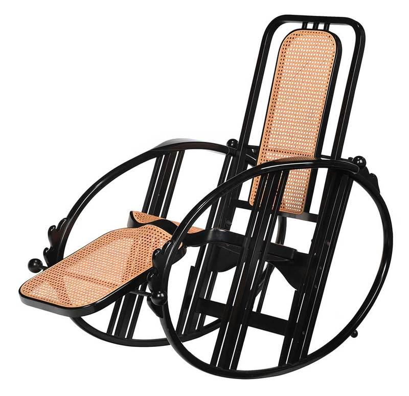 Antonio Volpe Black Lacquer Reclining Rocker: Italian, 20th century, after Josef Hoffman (Austrian, 1870-1956), egg rocking chair, with black lacquered bentwood frame, woven cane seats and rests, and adjustable back and foot rest; 43-1/2 x 28-1/2