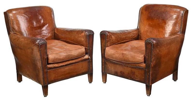 Pair Art Deco Leather Upholstered Club Chairs: French, circa 1930s, each with brown leather upholstery, set with brass tacking, 33 x 29 x 29 in., Provenance: The Estate of Robert and Joan Rash, Charlotte, North Carolina