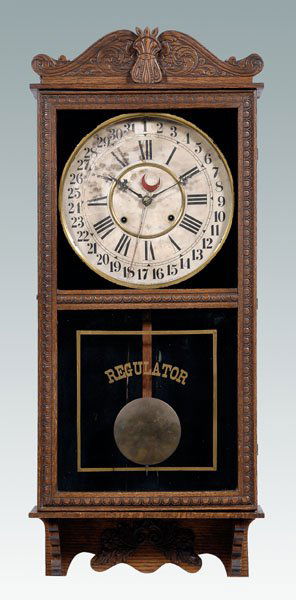 Gilbert regulator wall clock,: paper clock face with numeration for hours and days of month with mark for Gilbert Clock Company, time, strike and calendar movement, oak case, 38 x 15-1/2 x 4-1/2 in. Case refinished, paper on face w