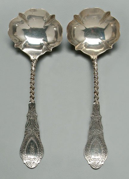 Pair Albert Cole coin silver ladles: