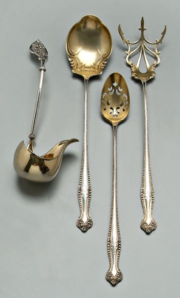 Four silver serving pieces