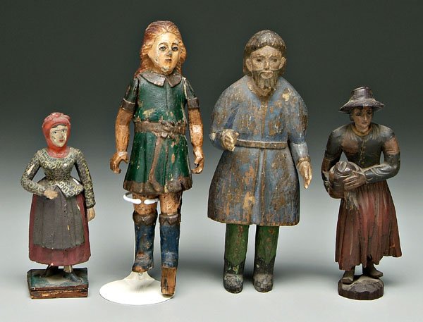 Group of four carved wood figures: