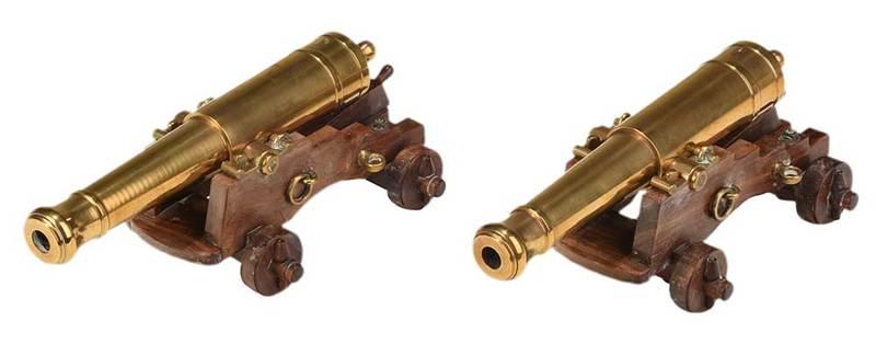 Pair Miniature Brass Cannons: probably American, 20th century, cast brass cannons on wooden gun carriages with brass mounts and retractable wedge shaped chocks, one engraved "4" and one "6" on underside, barrel, 7-1/2 in., 8 in. o
