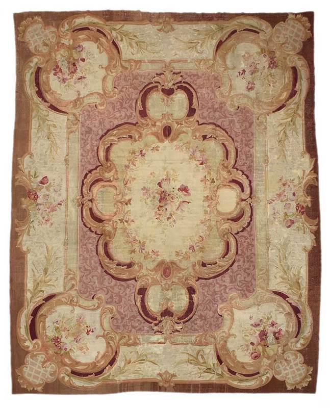 Aubusson Carpet: mid 19th century, floral central spray with acanthus leaf design, cartouche in each corner with florals and lattice design, 15 ft. 9 in. x 11 ft. 7 in.