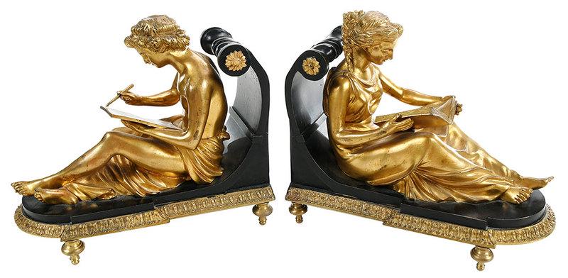 Pair Empire Style Gilt Bronze Figural Bookends: Continental, 19th/20th century, classical robed figures reading and writing, gilt bronze and metal bases, leaf and bead borders, floral rosettes, raised on four feet, 9-1/4 x 10-3/4 x 5-1/4 in.Provena