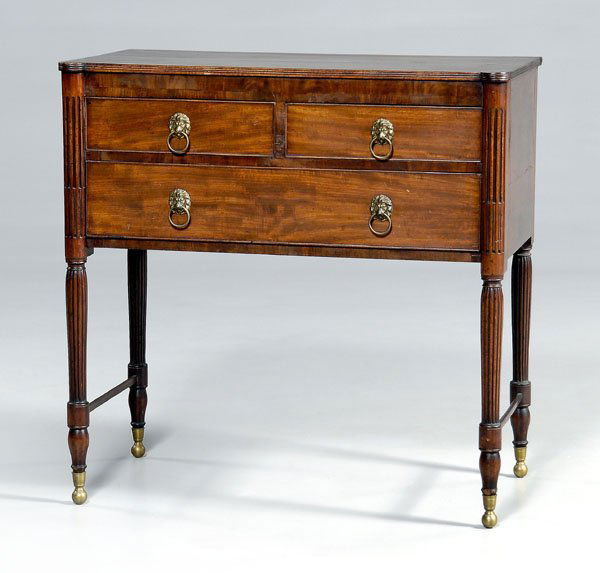 New York Federal mahogany server,: poplar and pine secondary, in the Duncan Phyfe style with three dovetailed drawers, fluted and reeded legs, possibly original brass pulls, 1800-1815, 36-1/2 x 36-1/2 x 20-1/2 in. Old refinishing, surf